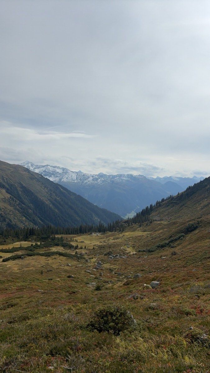 Broad track climbing through open terrain above Schlappin