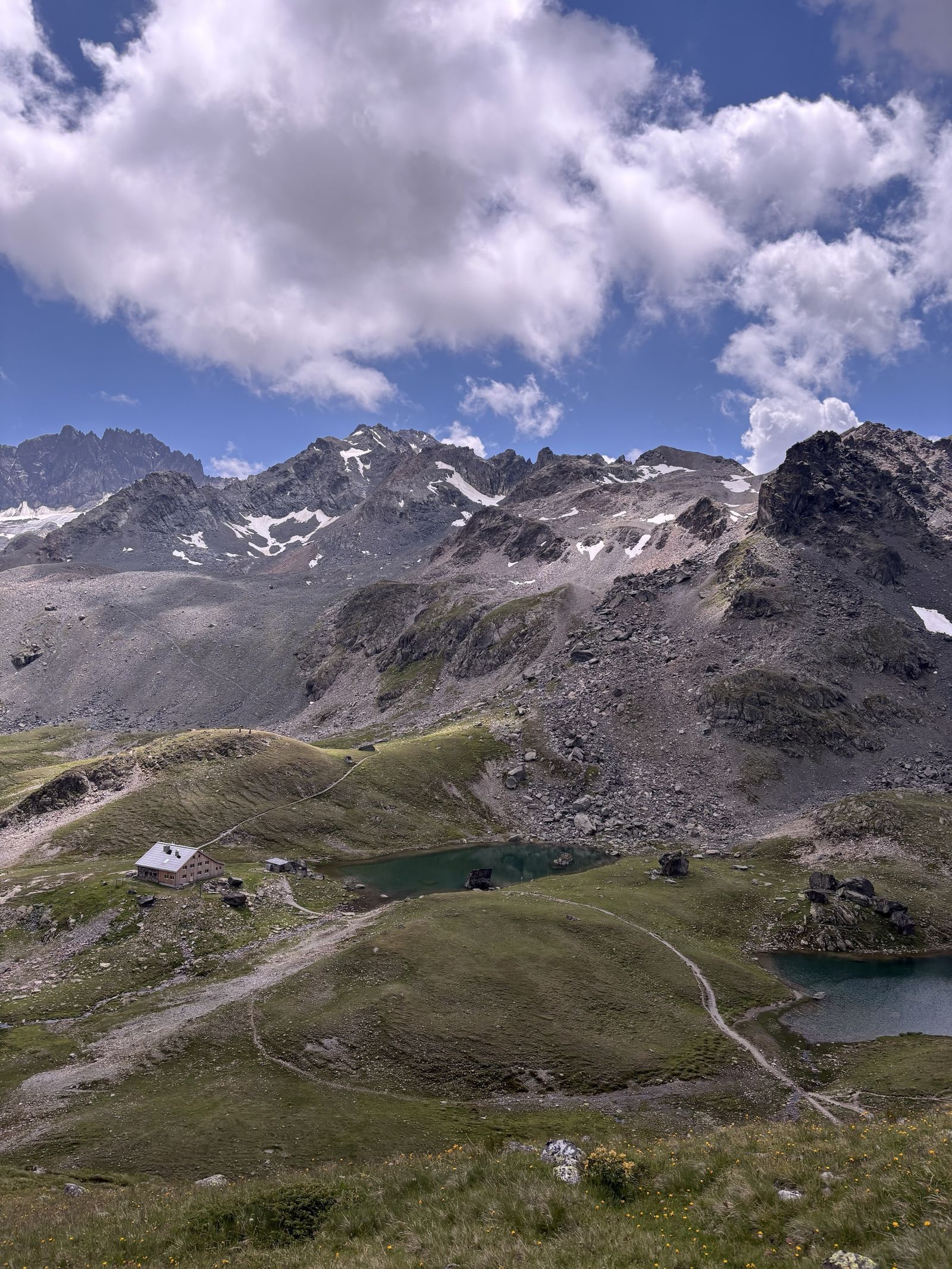 Grialetschhütte among small mountain lakes and rocky peaks