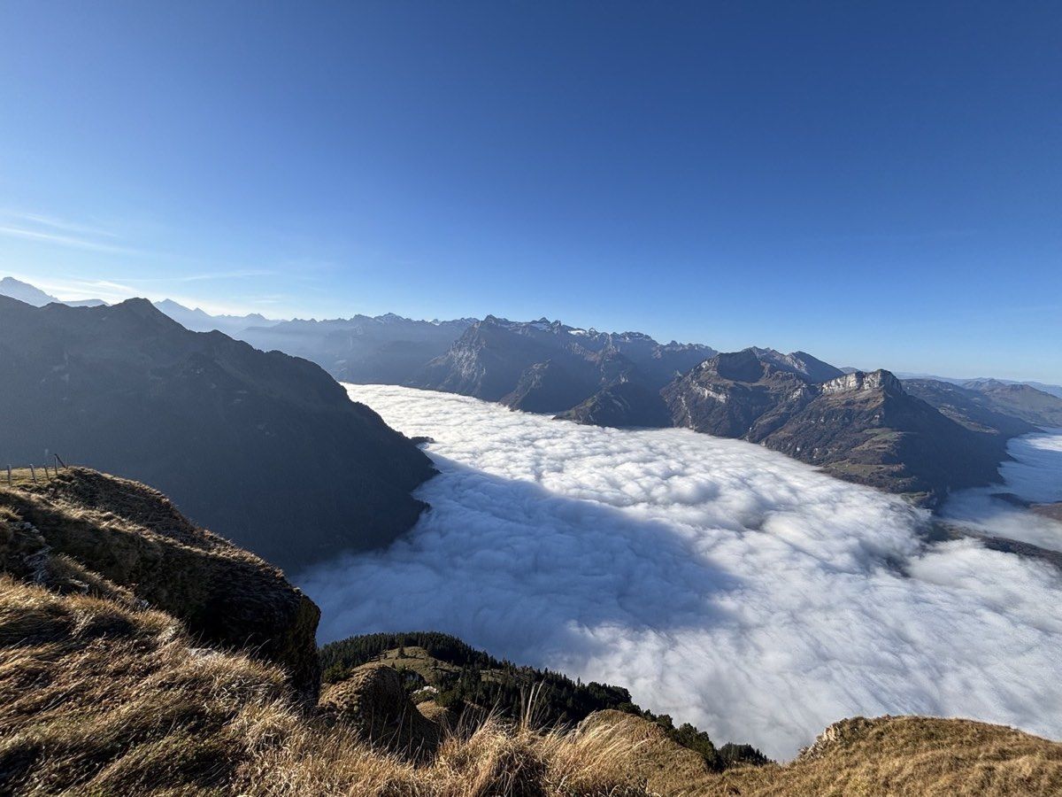 Mountain ridges rising above a sea of cloud in late autumn