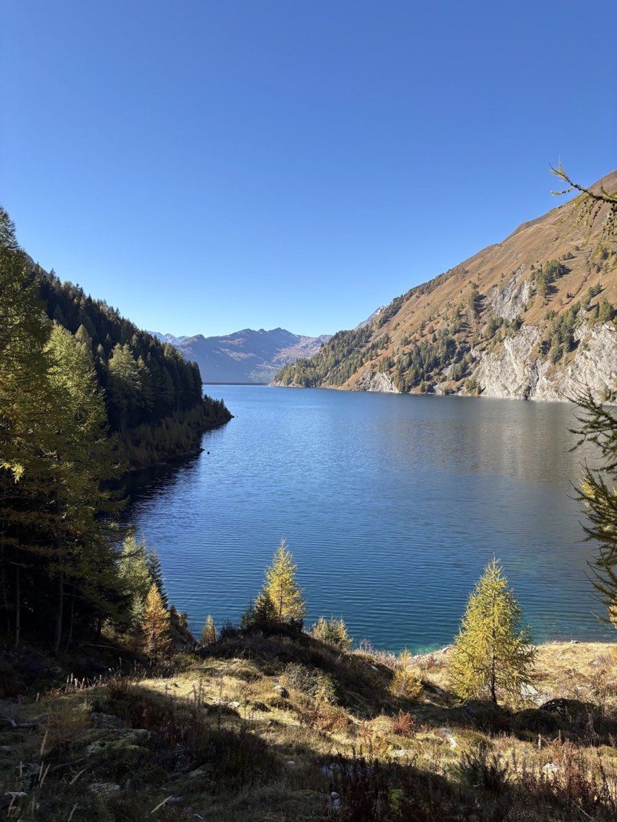 Lago di Luzzone below a steep mountain slope